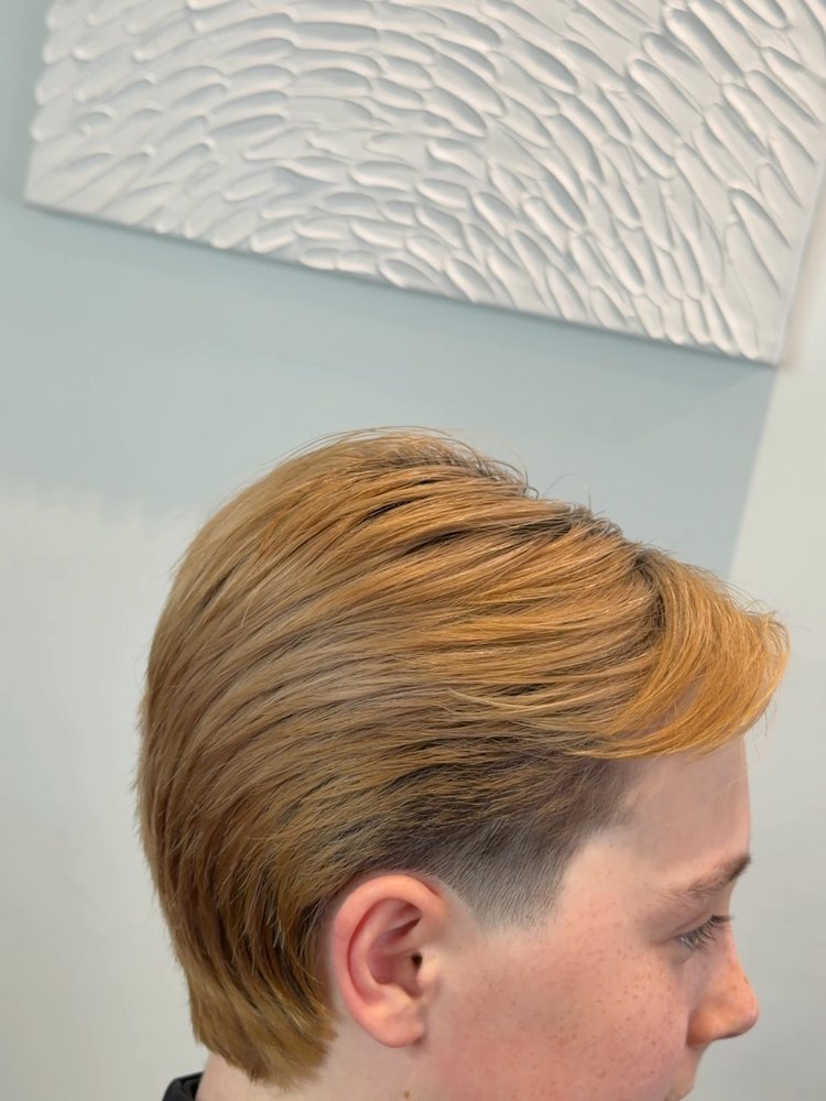 Slicked back copper blonde colour cut by Kobe Popek, hairstylist in Warman SK