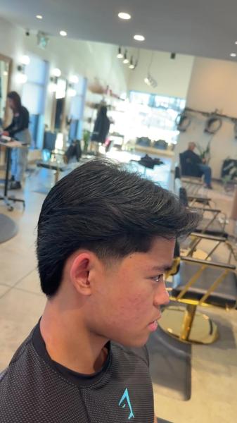 Men's low taper haircut with textured finish by Kobe Popek